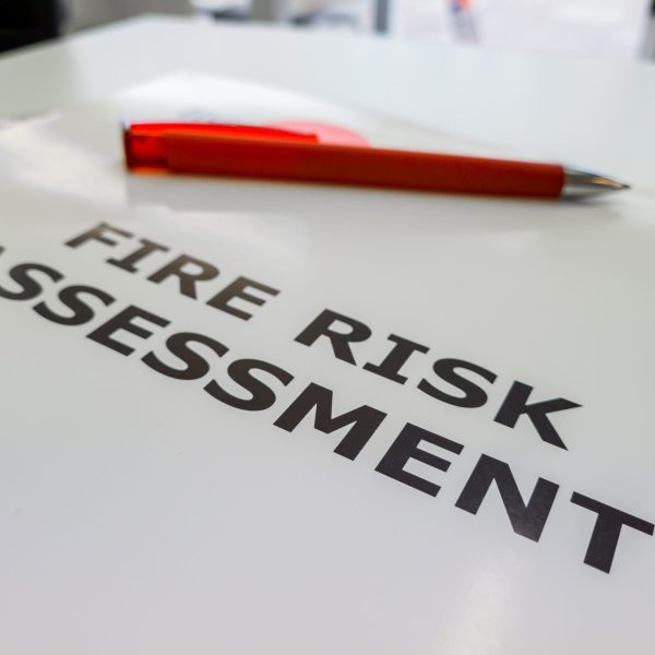 A file containing the Fire Risk Assessment, a legal requirement in the UK to assess and reduce the rise of fire for commercial properties, blocks of flats and workplaces.